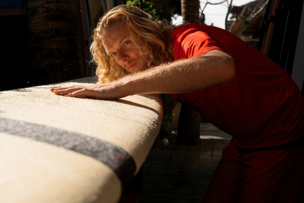 He Surfer Washes His Board With Water Bali